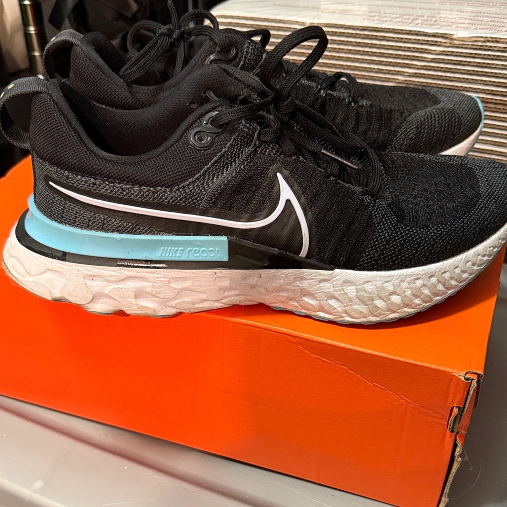 Nike Black and White Sneakers with Blue Detail